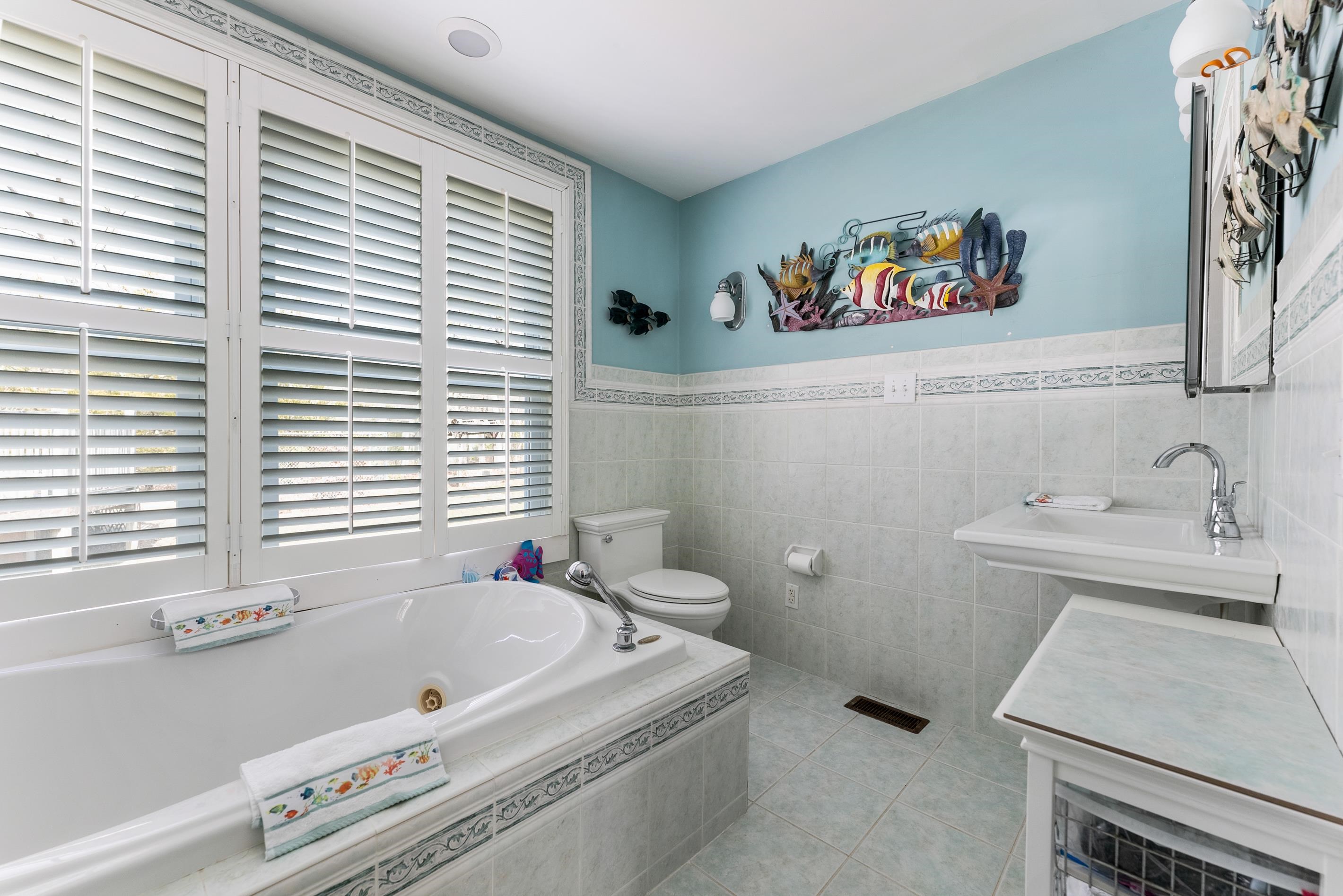 95 Peach Orchard Road Ocean View, NJ 08230 - Photo 22 of 41 a bathroom with a sink and a bathtub