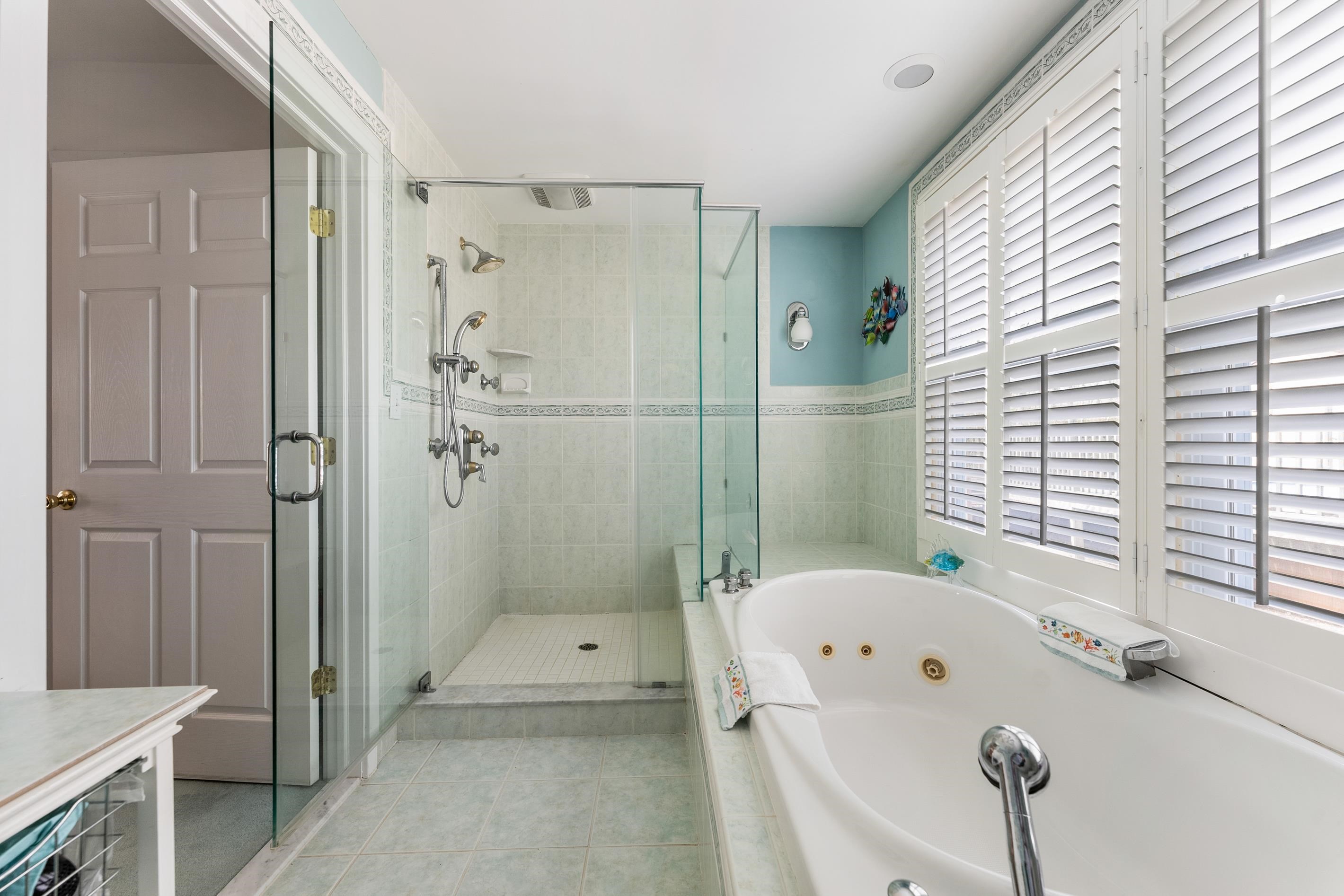 95 Peach Orchard Road Ocean View, NJ 08230 - Photo 23 of 41 a bathroom with a tub shower and a sink