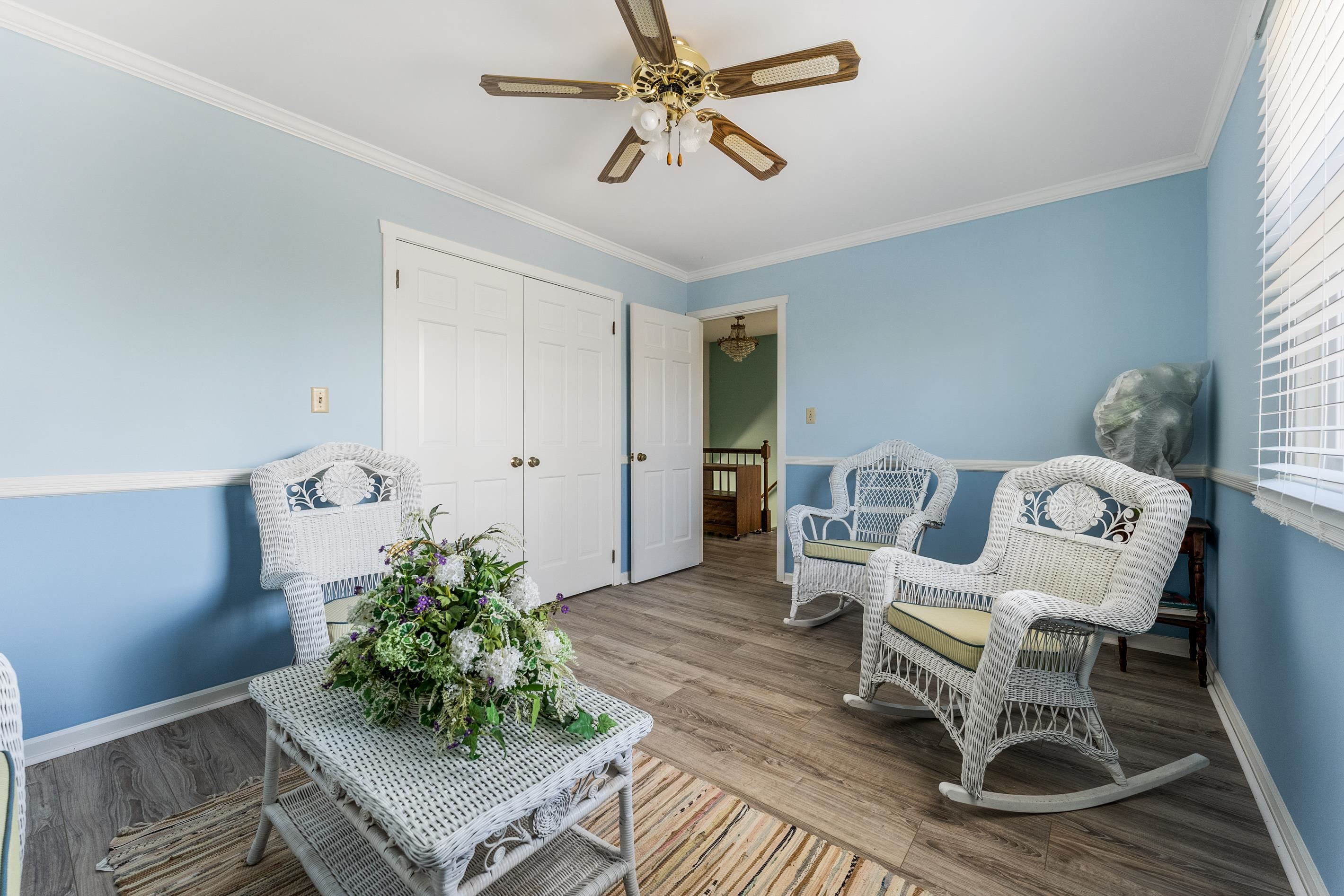 95 Peach Orchard Road Ocean View, NJ 08230 - Photo 25 of 41 a living room with furniture and a chandelier