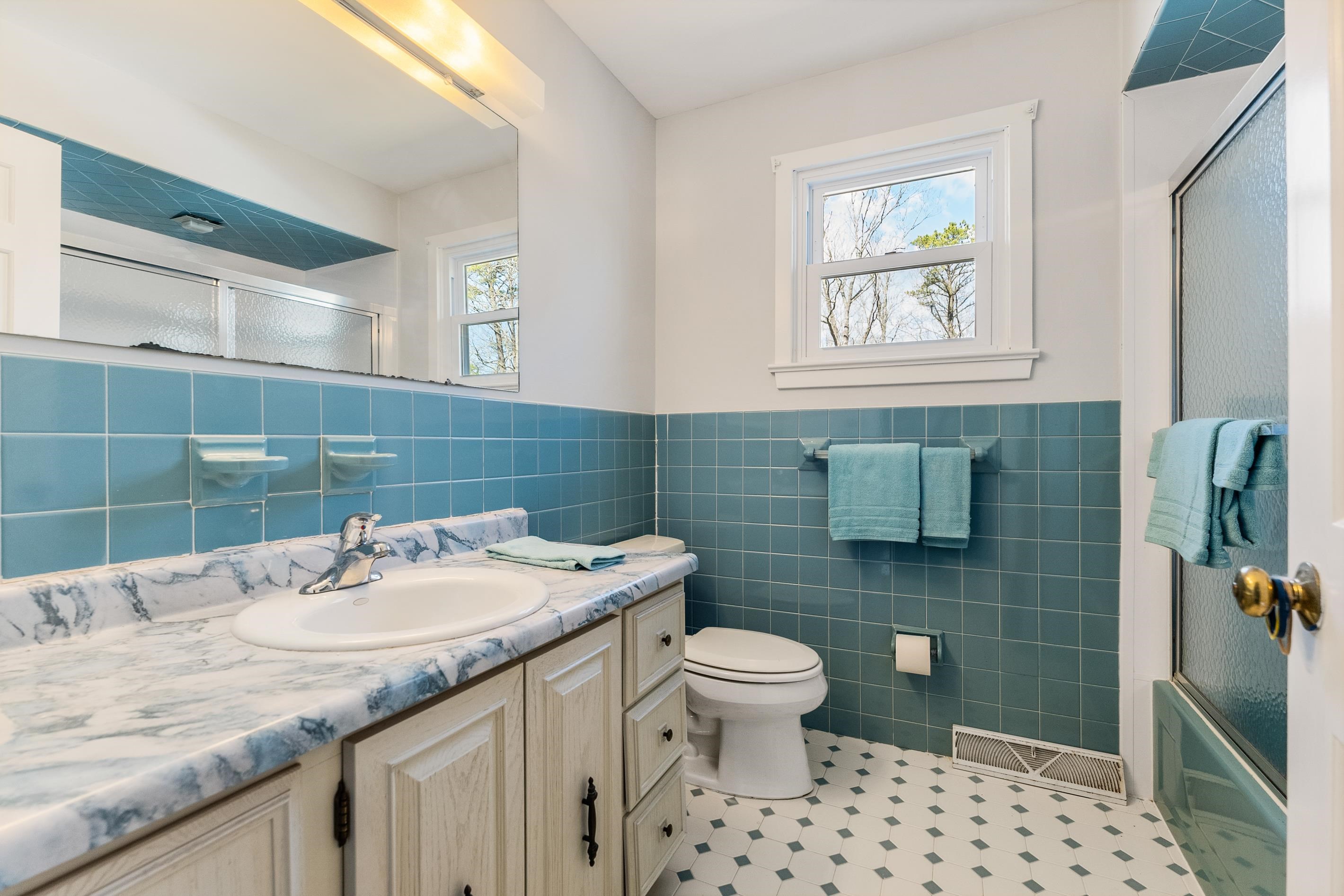 95 Peach Orchard Road Ocean View, NJ 08230 - Photo 32 of 41 a bathroom with a granite countertop toilet sink and mirror
