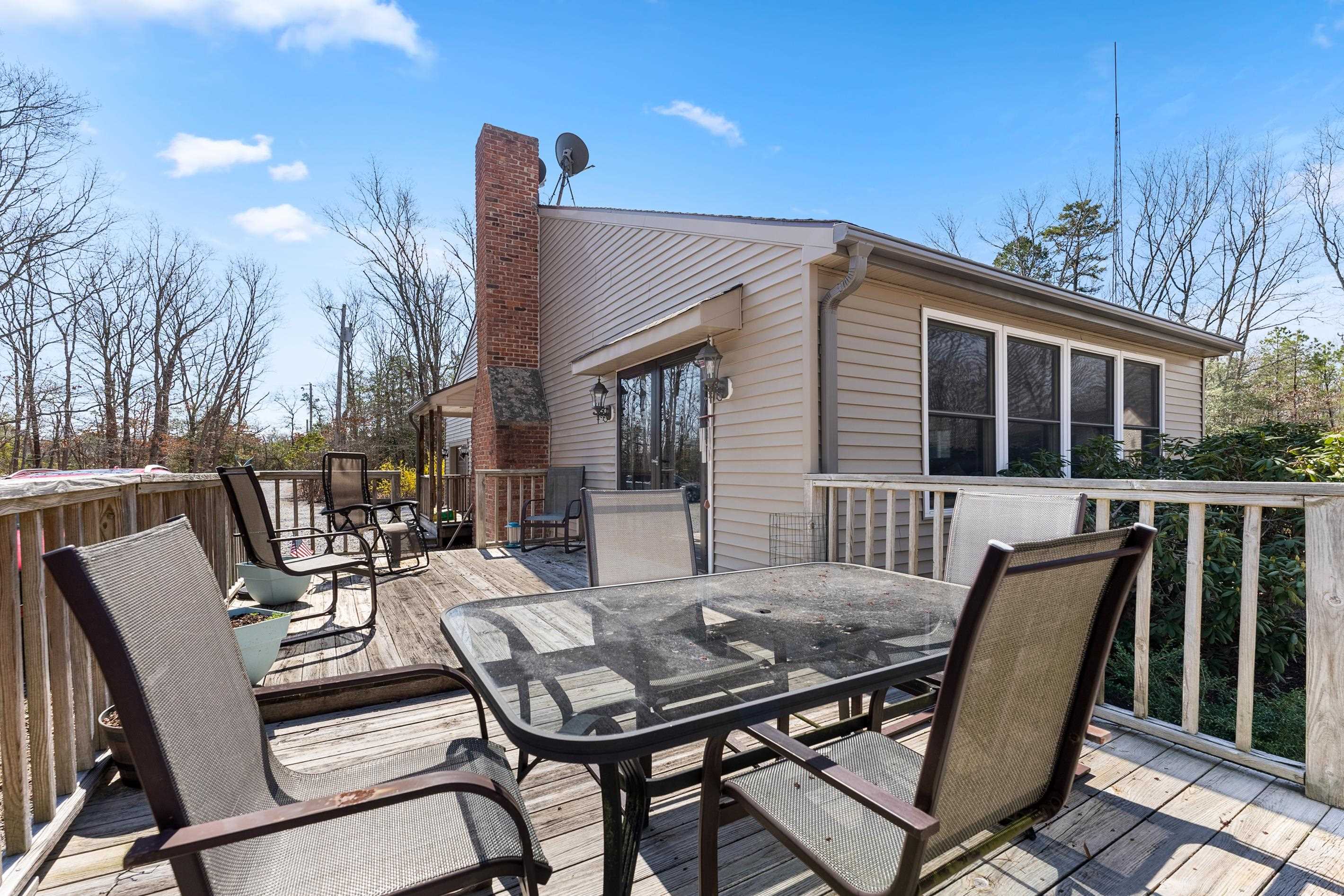 95 Peach Orchard Road Ocean View, NJ 08230 - Photo 36 of 41 a view of a patio with a table and chairs