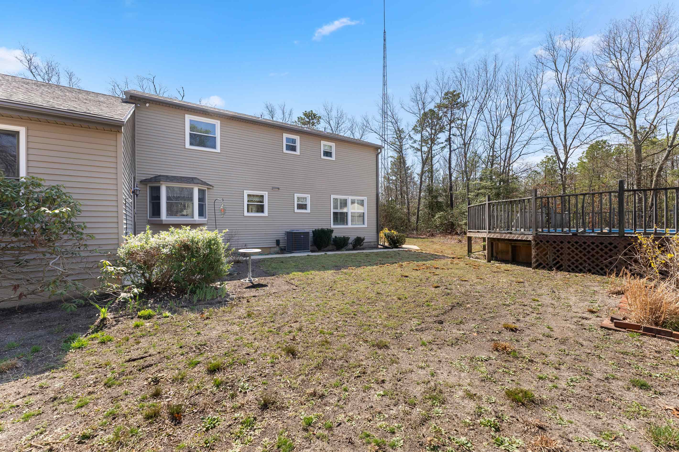 95 Peach Orchard Road Ocean View, NJ 08230 - Photo 38 of 41 a backyard of a house with lots of green space
