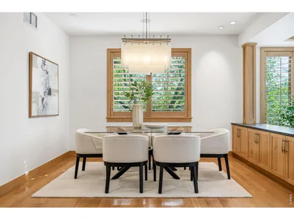 a kitchen with stainless steel appliances granite countertop a stove top oven a sink dishwasher and cabinets with wooden floor