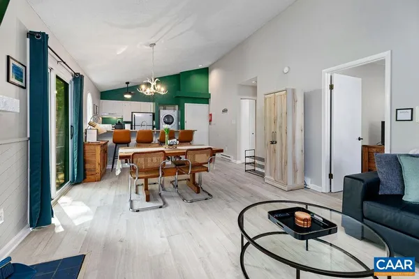 a view of a livingroom with furniture and wooden floor