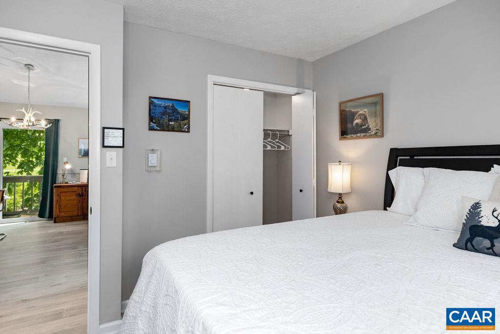 2209 Tanners Ridge Roseland, VA 22967 - Photo 14 of 21 a bedroom with a bed and painting on the wall