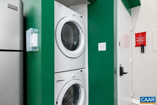 a view of a hallway with washer and dryer