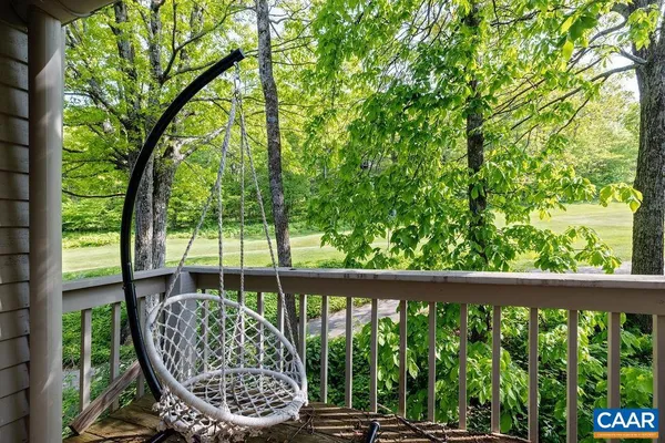 a view of a chair and table in the balcony