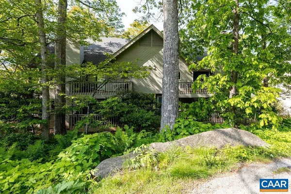 a backyard of a house with lots of green space