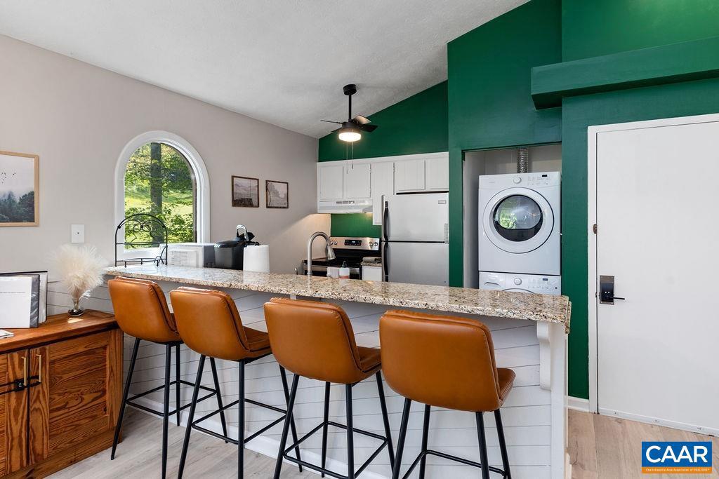 2209 Tanners Ridge Roseland, VA 22967 - Photo 2 of 21 a kitchen with a table chairs refrigerator and sink