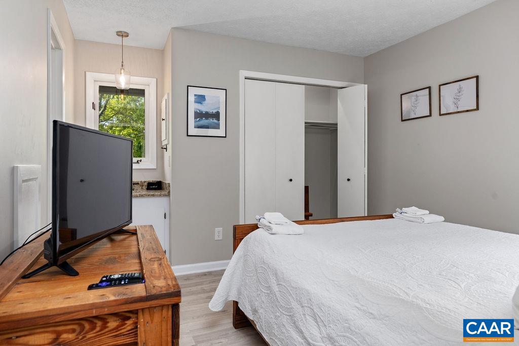 2209 Tanners Ridge Roseland, VA 22967 - Photo 10 of 21 a bedroom with a bed and a flat screen tv