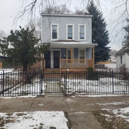a front view of a house with a garage