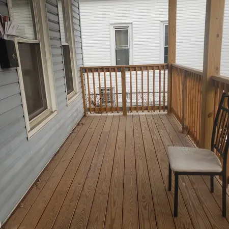 a view of deck with wooden floor and fence