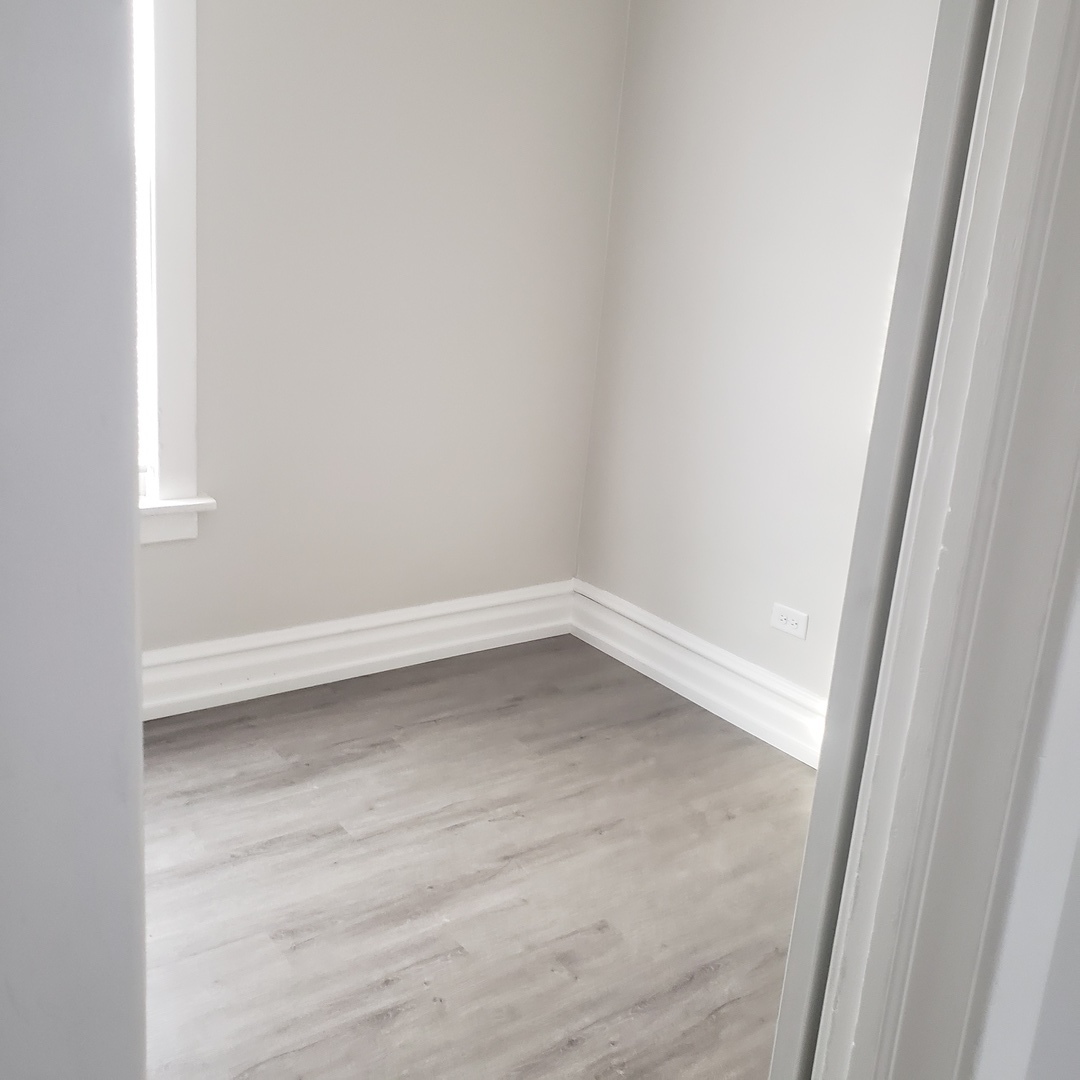 36 West 103rd Place, Unit 2 Chicago, IL 60628 - Photo 6 of 10 a view of an empty room