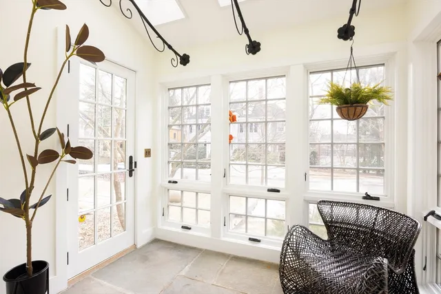 a bedroom with furniture and a window