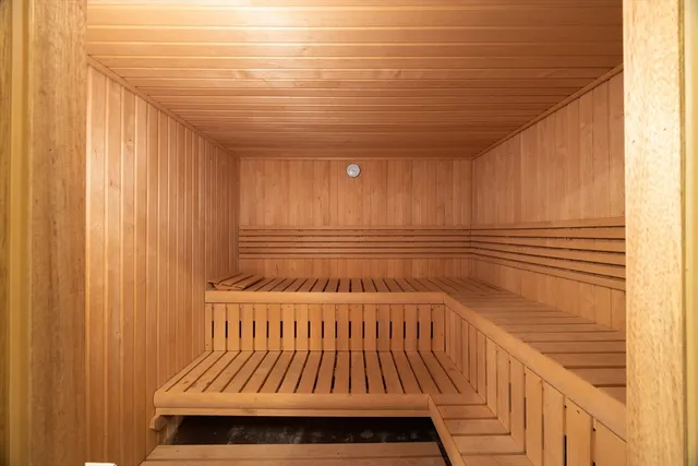 a view of a room with wooden walls