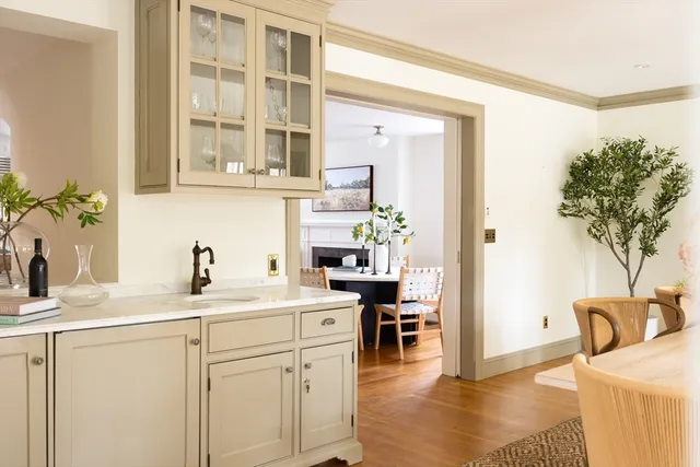 a kitchen with a sink a stove and cabinets