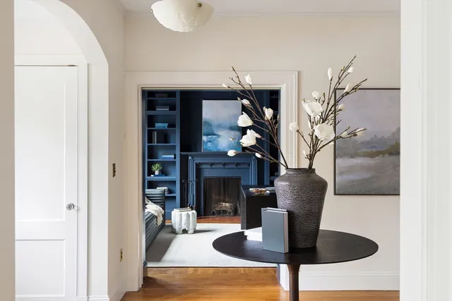 a dining room with furniture and a fireplace