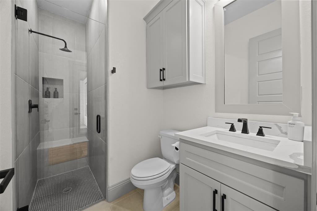 6317 Vega Road Godley, TX 76044 - Photo 18 of 27 a bathroom with a sink toilet and shower