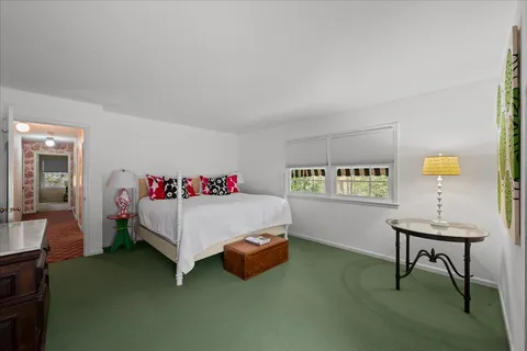 a bed room with a bed and a table