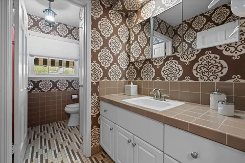 a bathroom with a sink and a mirror