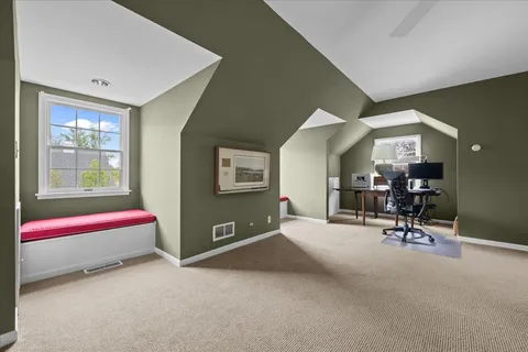 a bedroom with furniture and a window