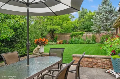 a view of an outdoor sitting area with furniture