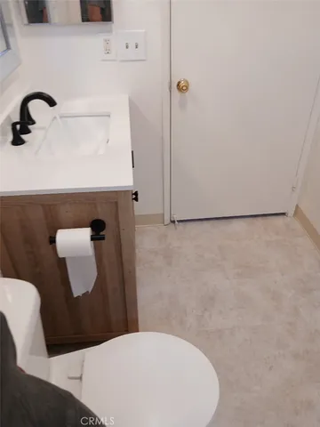 a bathroom with a sink and mirror