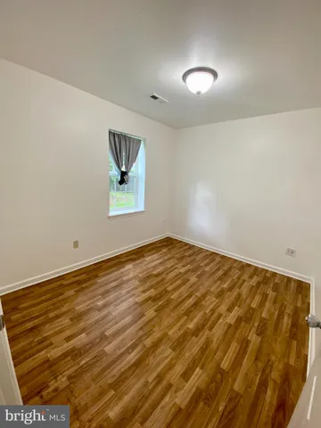 an empty room with window