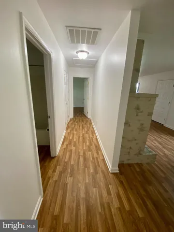 a view of a hallway view with staircase