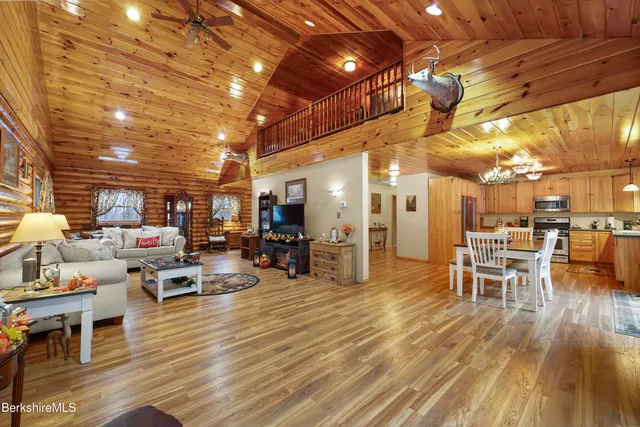 a view of a patio with table and chairs