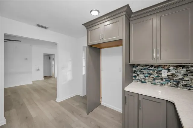 a kitchen with a sink and cabinets