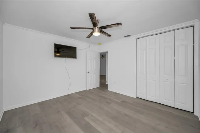 a view of a livingroom with a ceiling fan and a ceiling fan