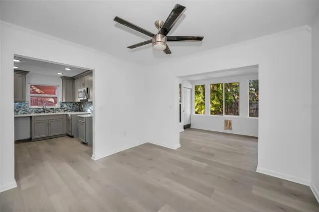a view of a kitchen with a sink and a window