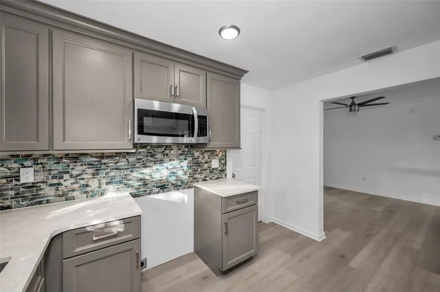 a kitchen with a stove and a sink