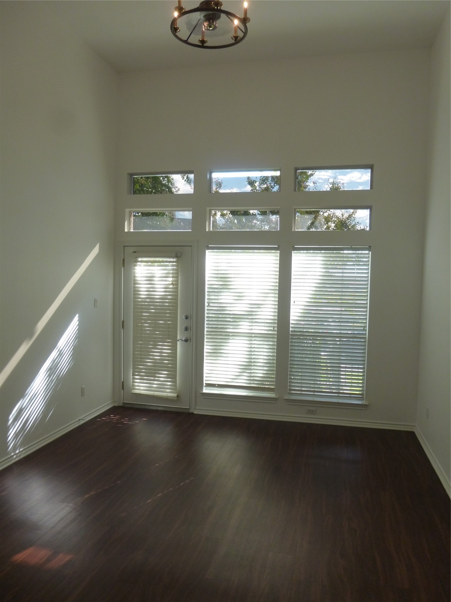 2918 Ranch Road 620 North, Unit Y194 Austin, TX 78734 - Photo 16 of 35 a view of an empty room with wooden floor and a window