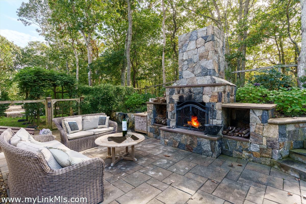 18 Cormorant Circle Edgartown, MA 02539 - Photo 22 of 42 a patio with couches and a fire pit