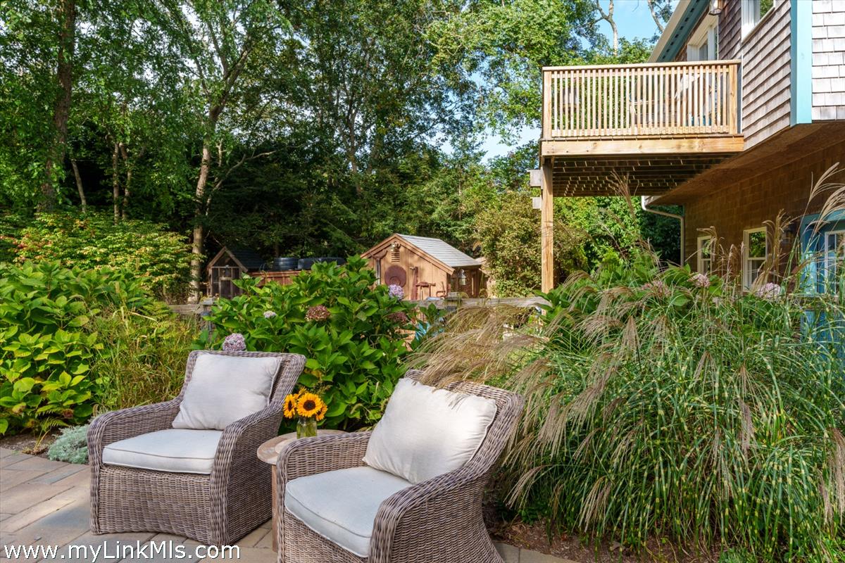 18 Cormorant Circle Edgartown, MA 02539 - Photo 26 of 42 a view of backyard with seating space and trees