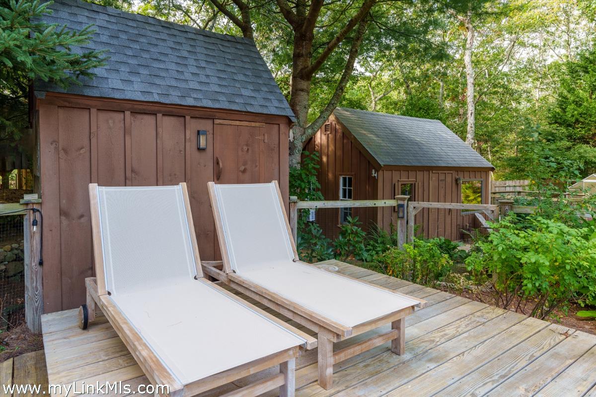18 Cormorant Circle Edgartown, MA 02539 - Photo 27 of 42 a view of a house with backyard and sitting area