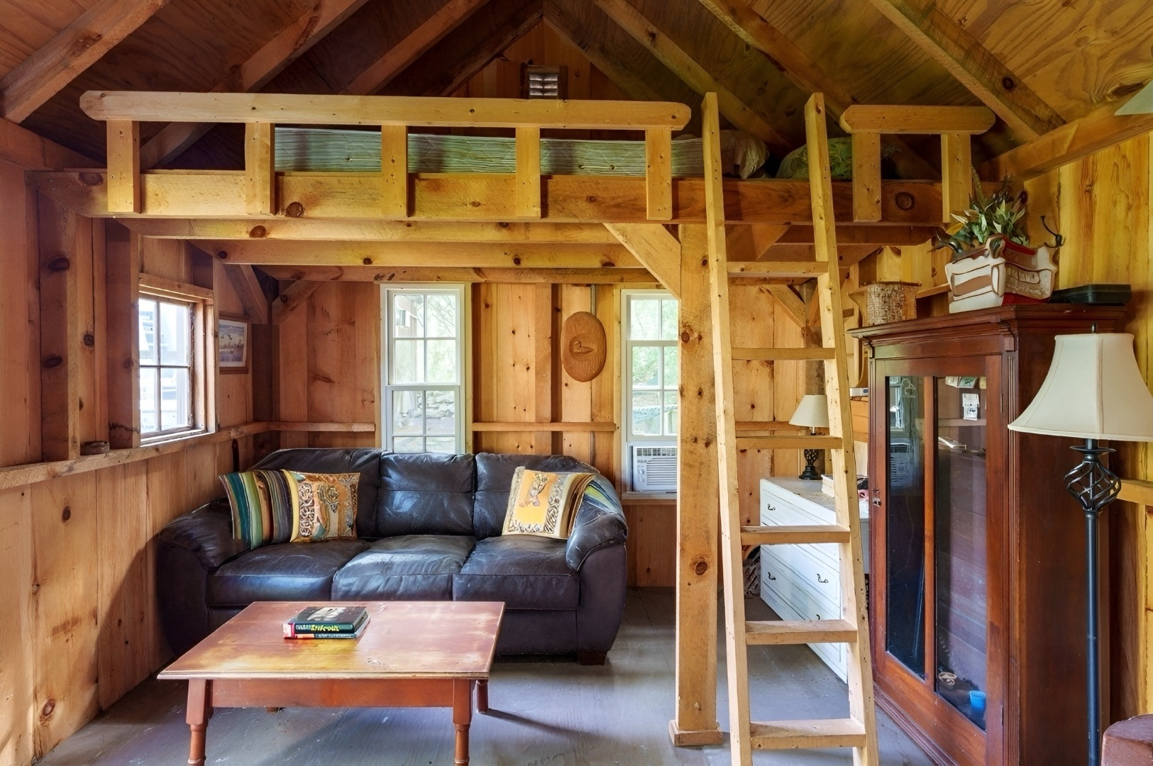 18 Cormorant Circle Edgartown, MA 02539 - Photo 28 of 42 a view of a patio with a couch and wooden floor