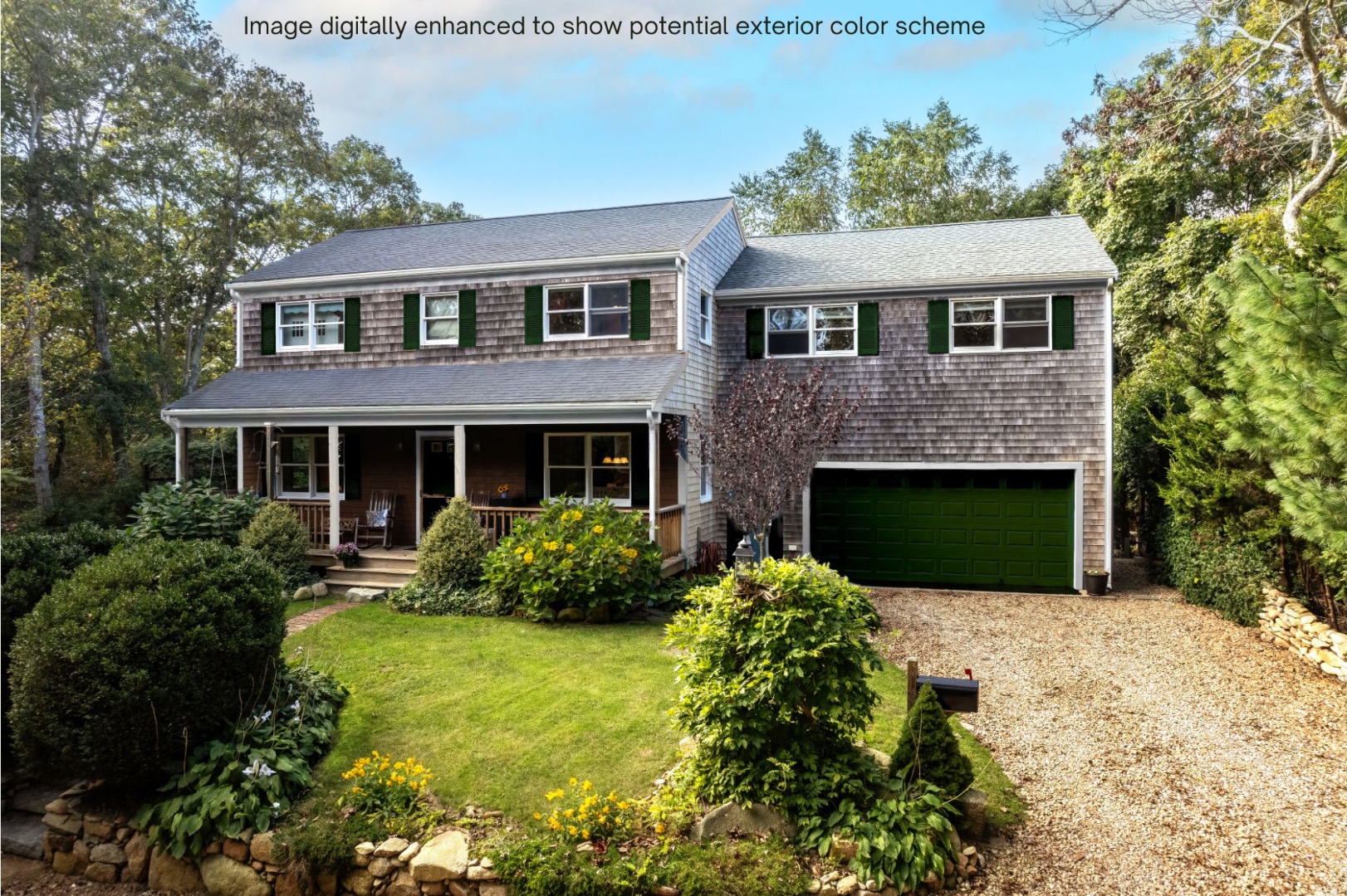 18 Cormorant Circle Edgartown, MA 02539 - Photo 34 of 42 a front view of a house with a yard and garage