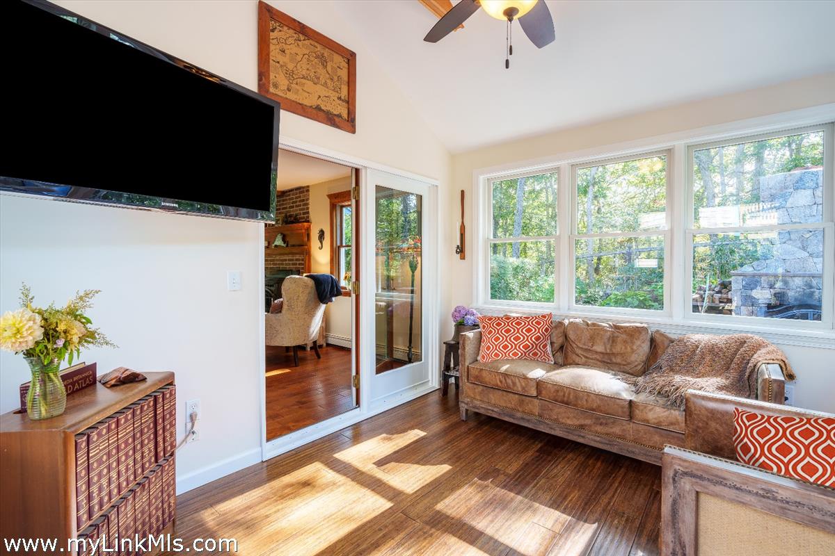 18 Cormorant Circle Edgartown, MA 02539 - Photo 9 of 42 a living room with furniture and a flat screen tv