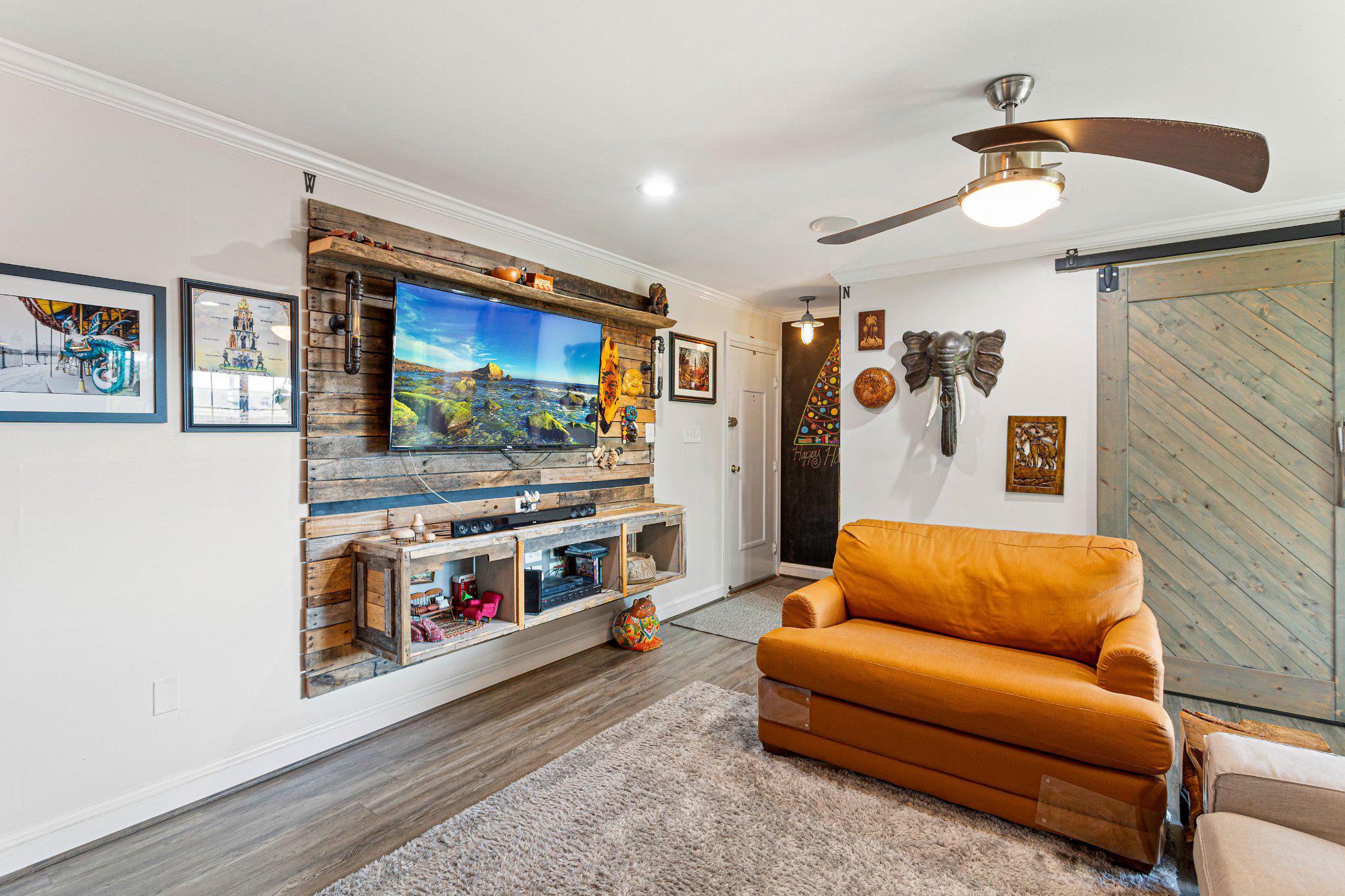 5613 Franconia Road, Unit 303 Alexandria, VA 22310 - Photo 7 of 27 a living room with furniture and a flat screen tv