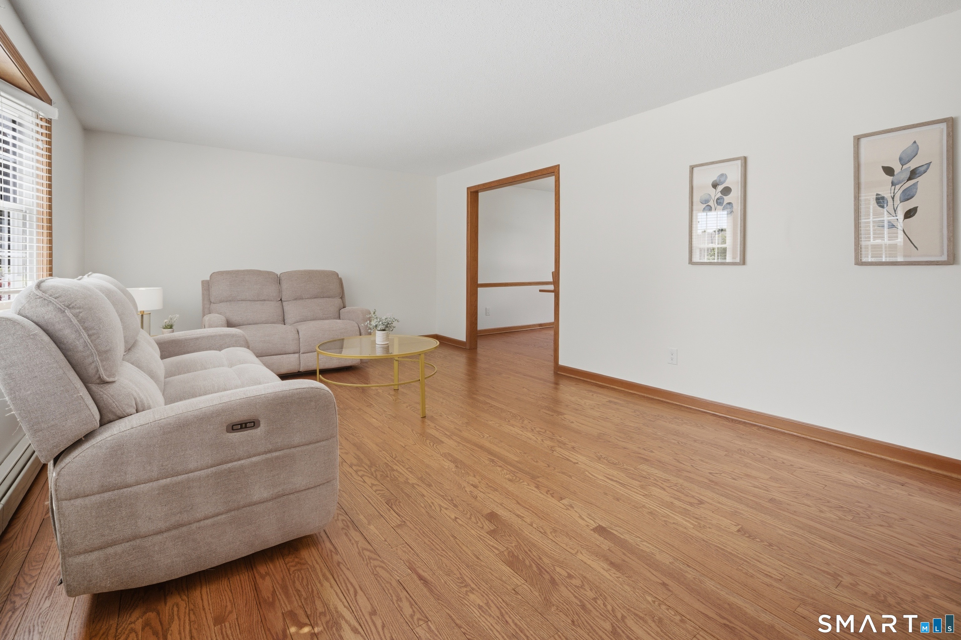 211 Valley View Road Manchester, CT 06040 - Photo 6 of 39 a living room with furniture and a wooden floor