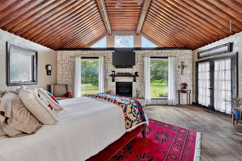 1717 1/2 Batey Road Collinsville, TX 76233 - Photo 17 of 40 a bed sitting in a spacious bedroom next to a window