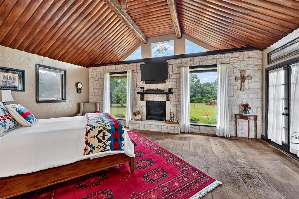 1717 1/2 Batey Road Collinsville, TX 76233 - Photo 18 of 40 a living room with furniture fireplace and flat screen tv