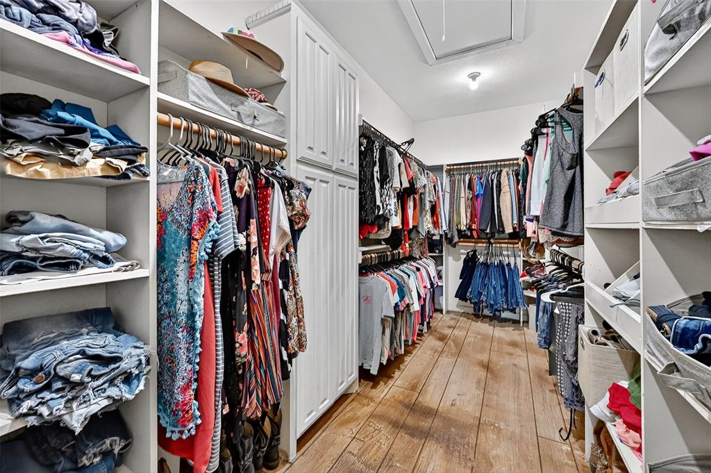 1717 1/2 Batey Road Collinsville, TX 76233 - Photo 21 of 40 a view of walk in closet with clothes and shoes