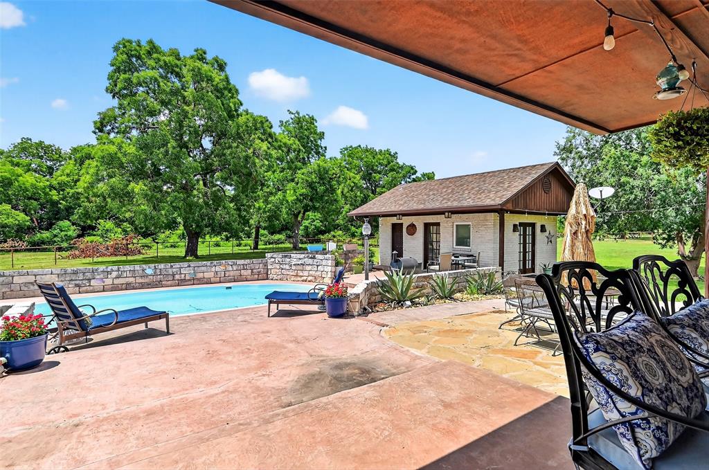 1717 1/2 Batey Road Collinsville, TX 76233 - Photo 28 of 40 swimming pool view with a seating space