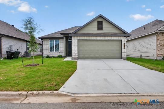 1915 Meridian Loop Temple, TX 76504 - Photo 1 of 29 a front view of a house with a yard and garage