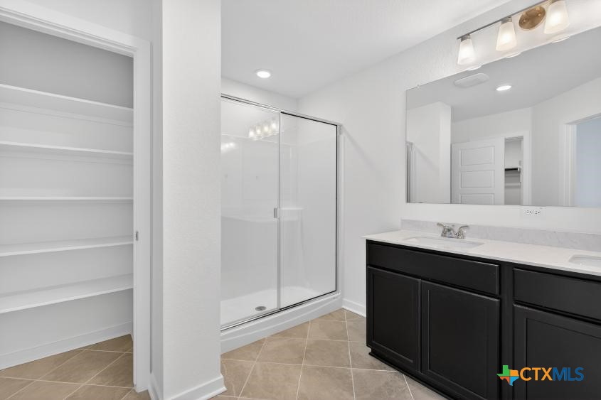 1915 Meridian Loop Temple, TX 76504 - Photo 24 of 29 a bathroom with a double vanity sink mirror and shower