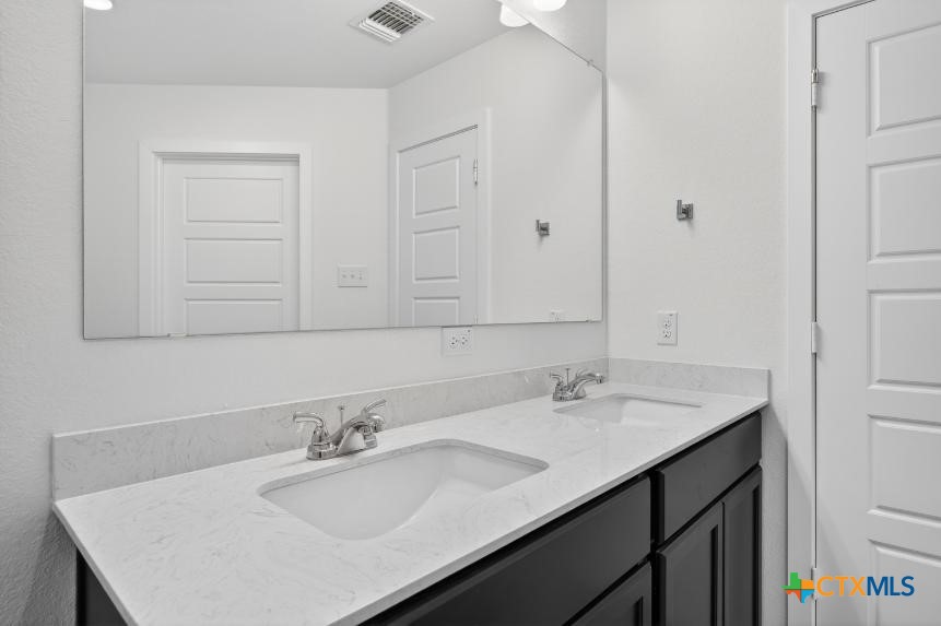 1915 Meridian Loop Temple, TX 76504 - Photo 25 of 29 a bathroom with a sink and a mirror